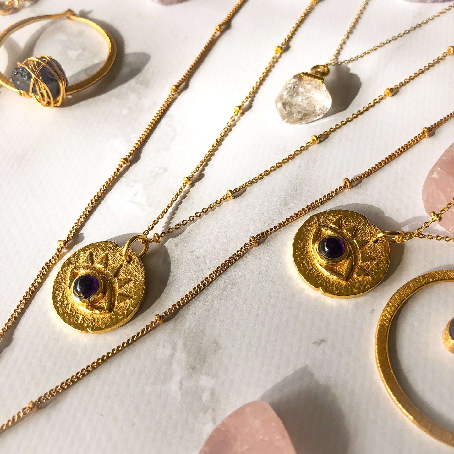 Evil eye pendant gold coloured with amethyst