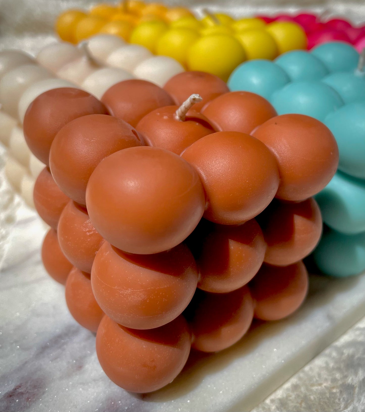 Brown bubble candle on marble 