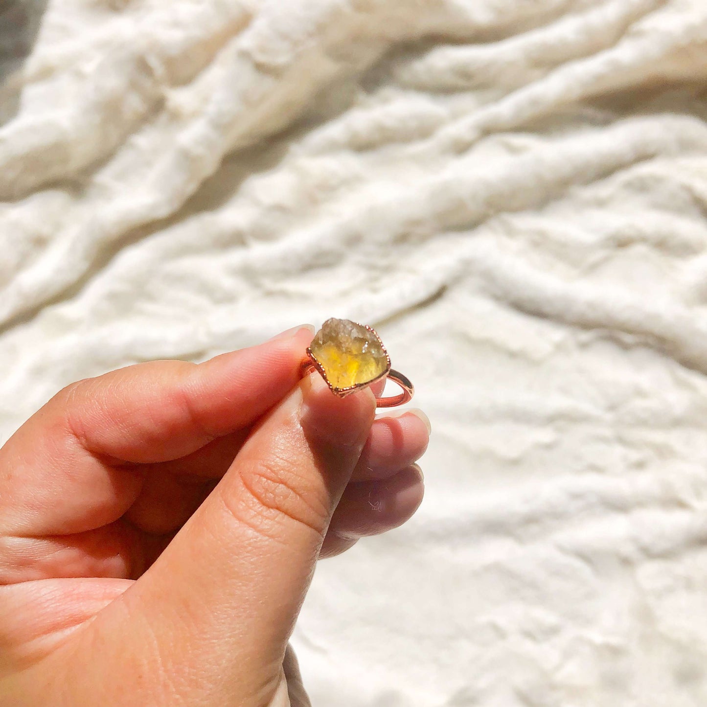 Citrine ring in hand