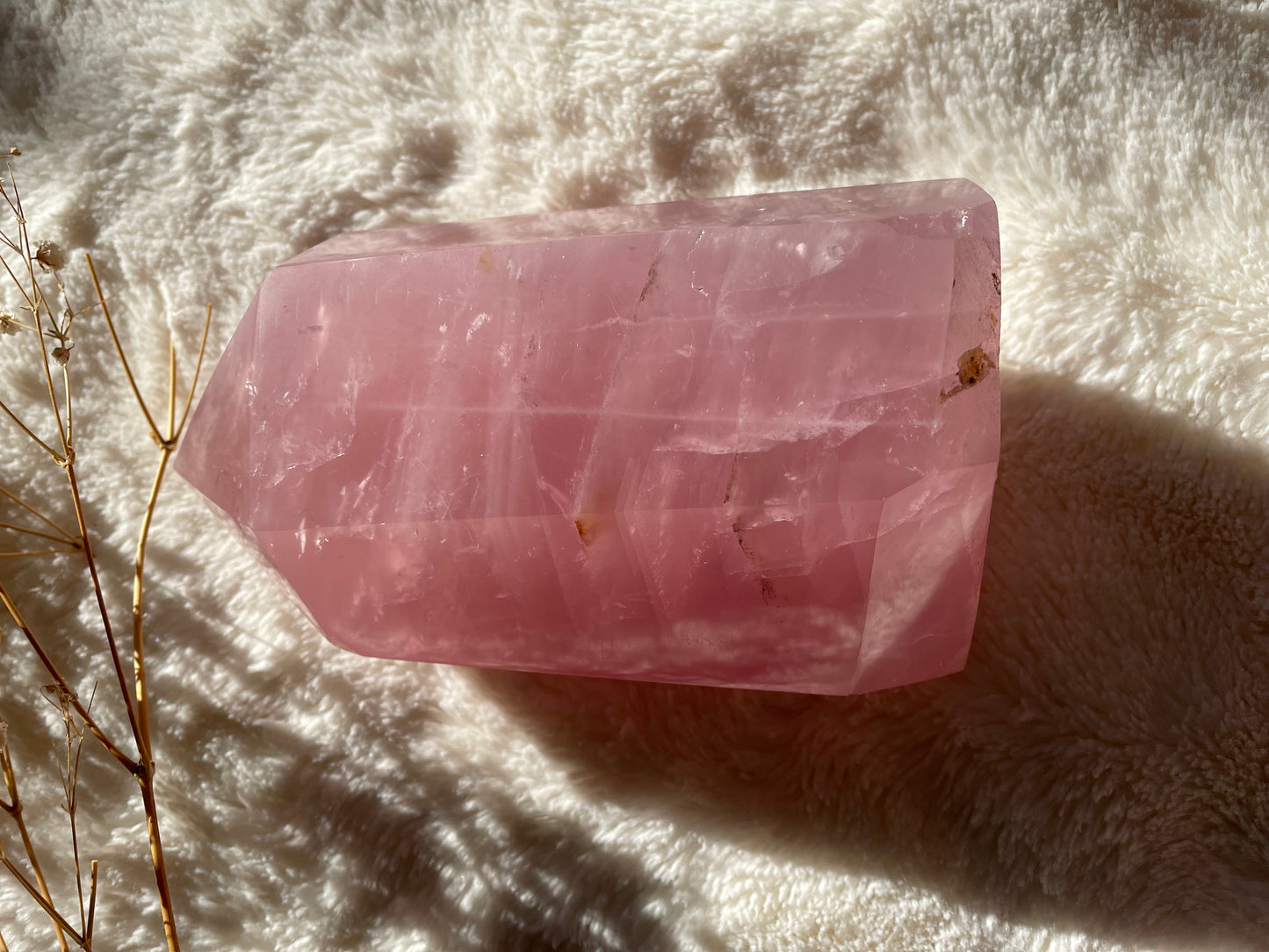 Rose quartz crystal point