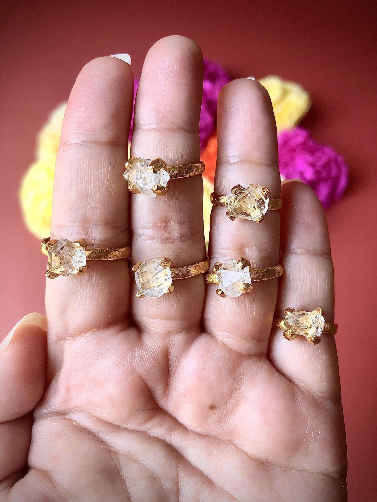 Multiple herkimer diamind rings on fingers